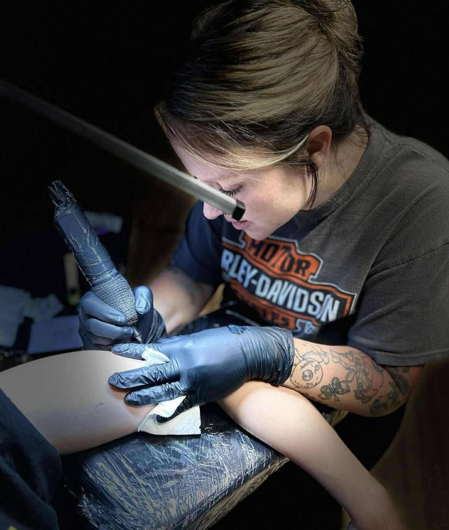Tattoo artist at work at Rebel Roots Tattoo, Logan Iowa